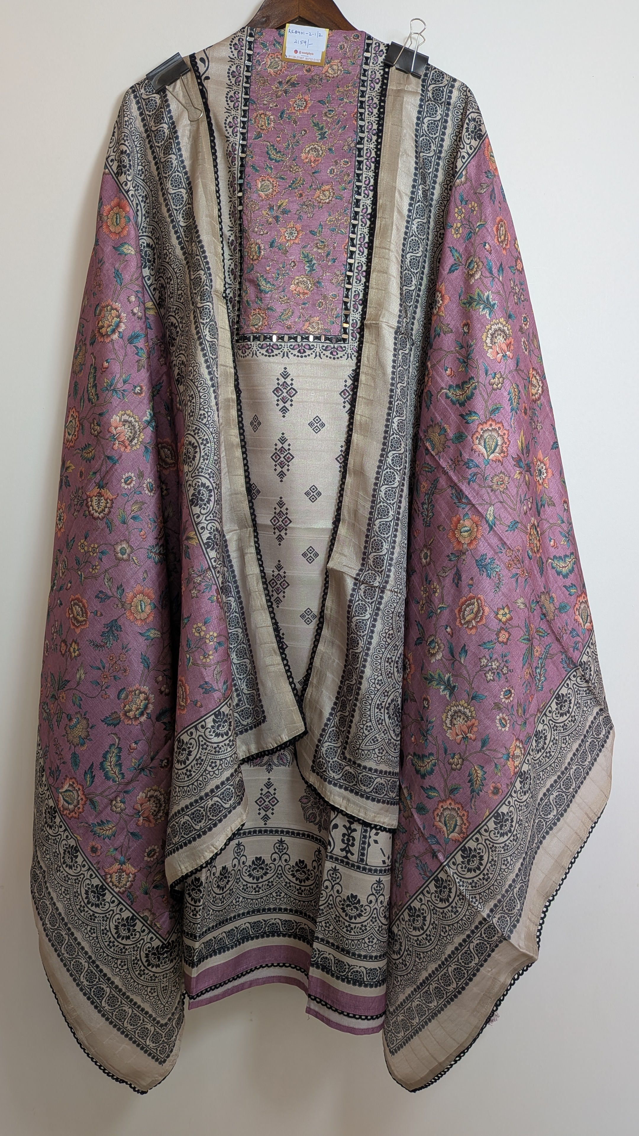 Decorative scarf with intricate patterns on a white background