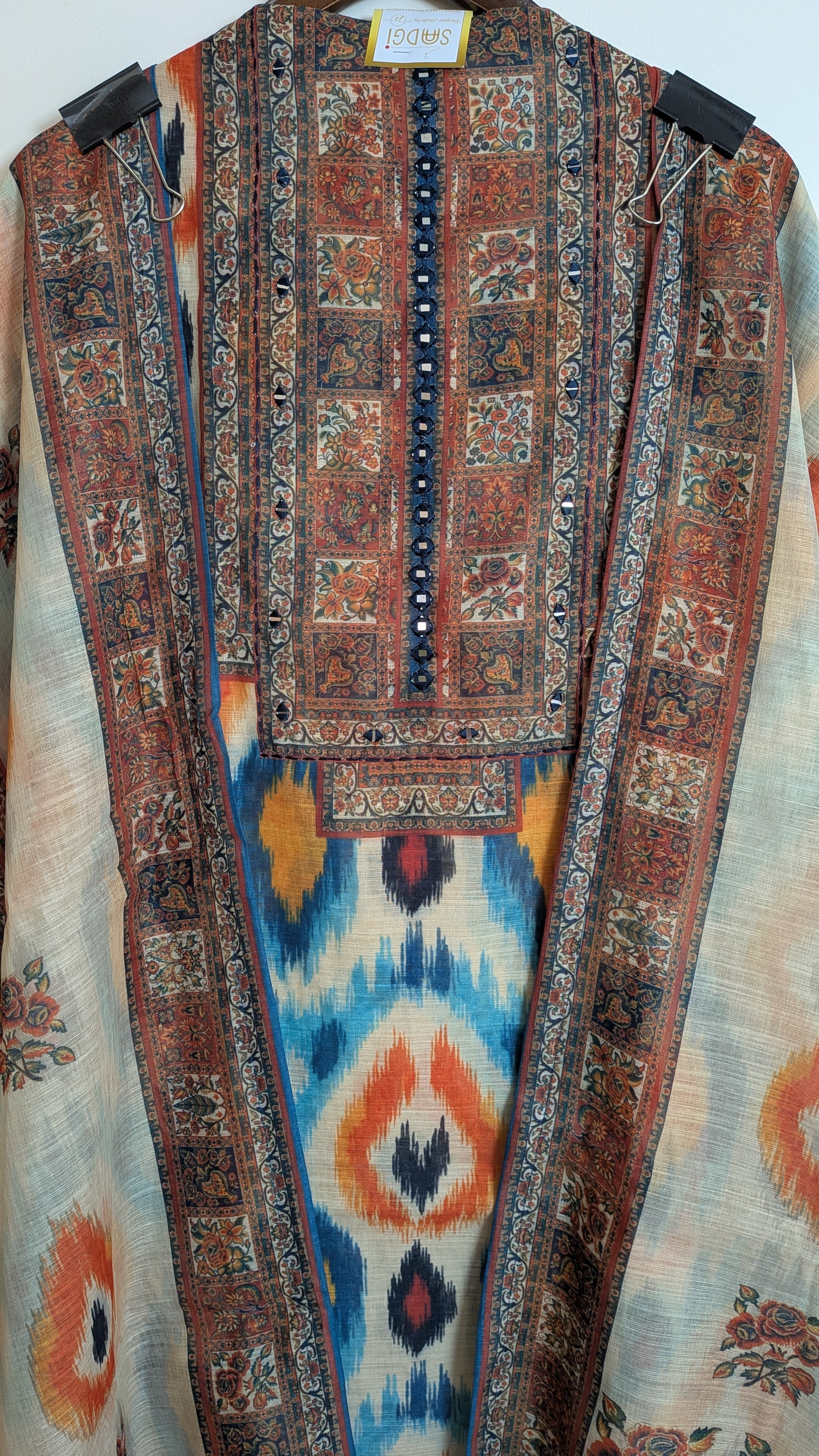 Decorative fabric with intricate patterns on a plain background